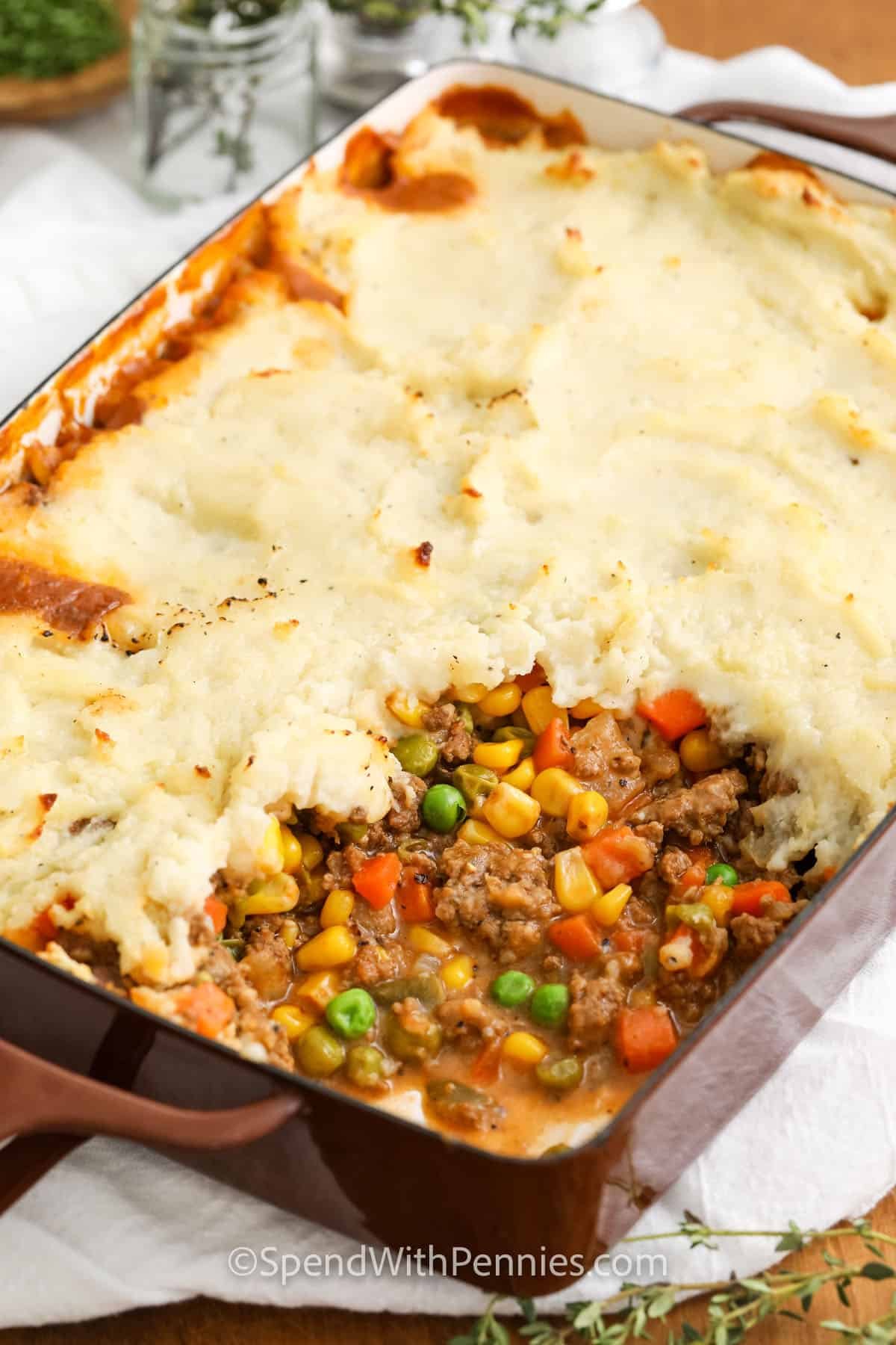 casserole dish of Shepherd's Pie with a portion missing