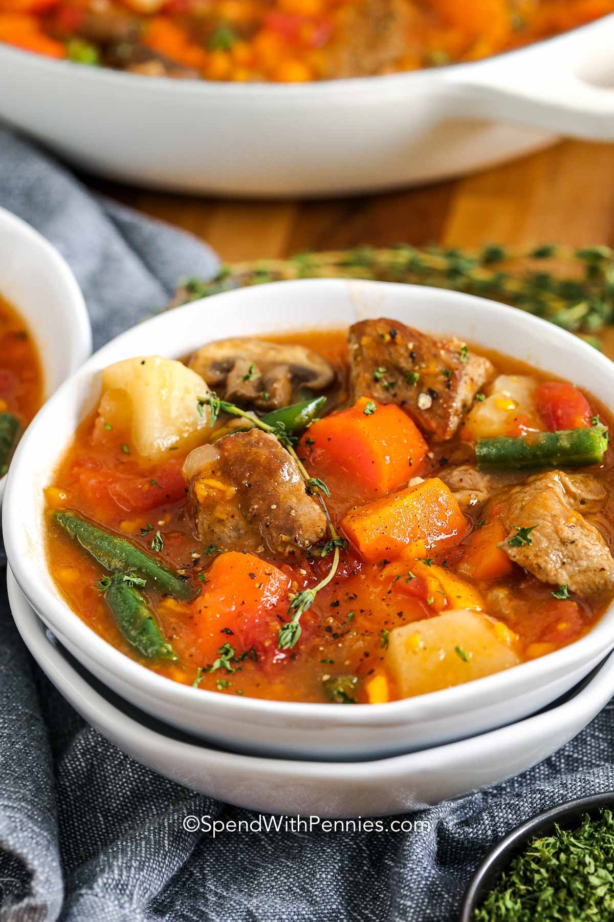 pork stew in a white bowl