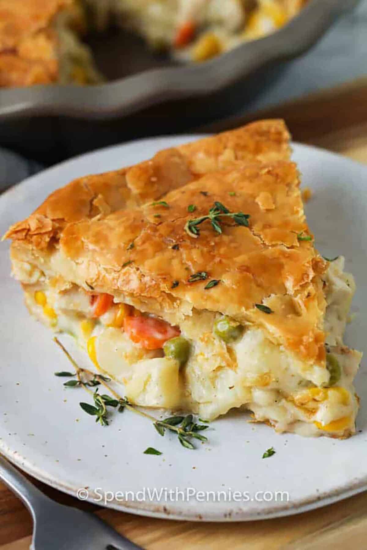 filling slice of Homemade Chicken Pot Pie on a plate