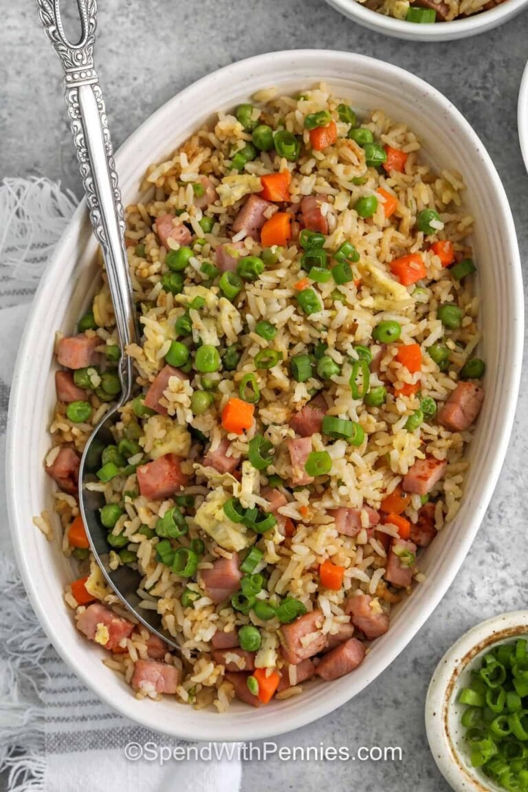 ham fried rice in a serving bowl with a spoon