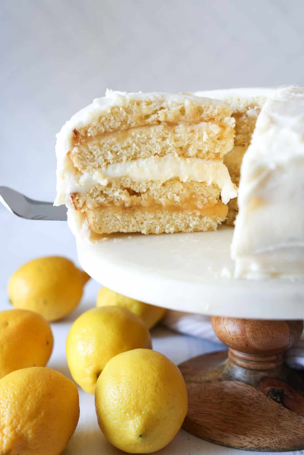 Serving a slice of lemon cake on a cake plate